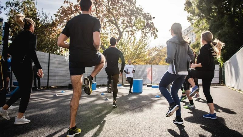 Person running along a riverside trail at early morning light, representing aerobic exercise for BDNF and neuroplasticity