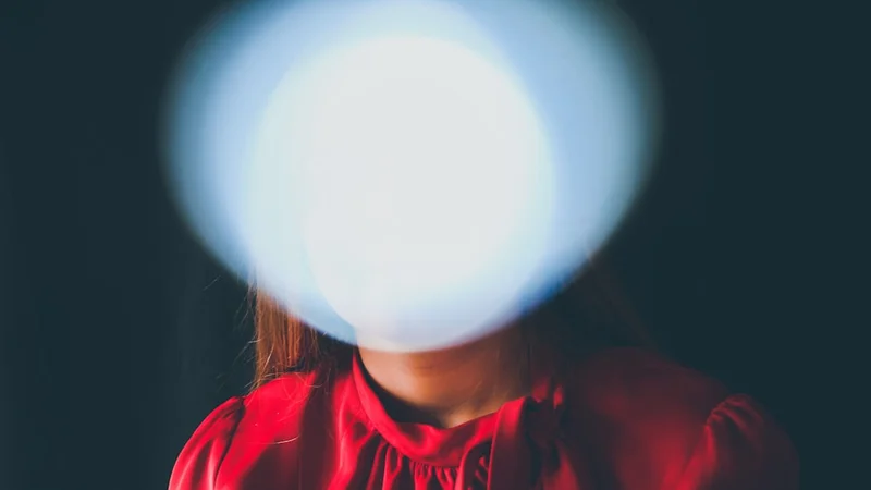 multiple overlapping spotlights converging on an empty stage, metaphor for the spotlight effect, clean conceptual illustration