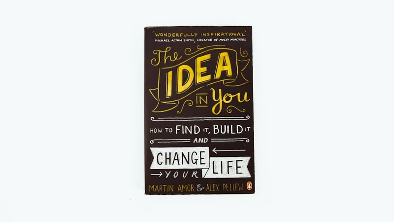 An open journal with handwritten goals and a cup of coffee beside it on a wooden desk, symbolizing intentional self-design and the practice of designing your future