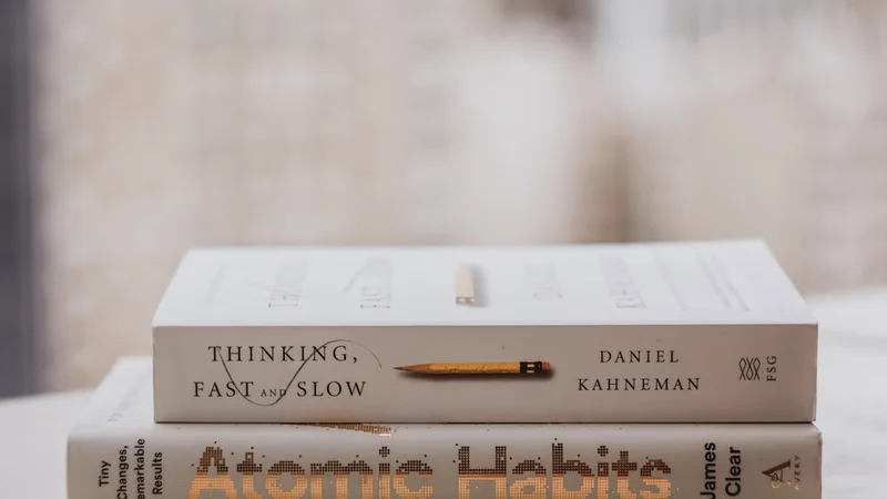 person journaling at a desk in the evening, warm light