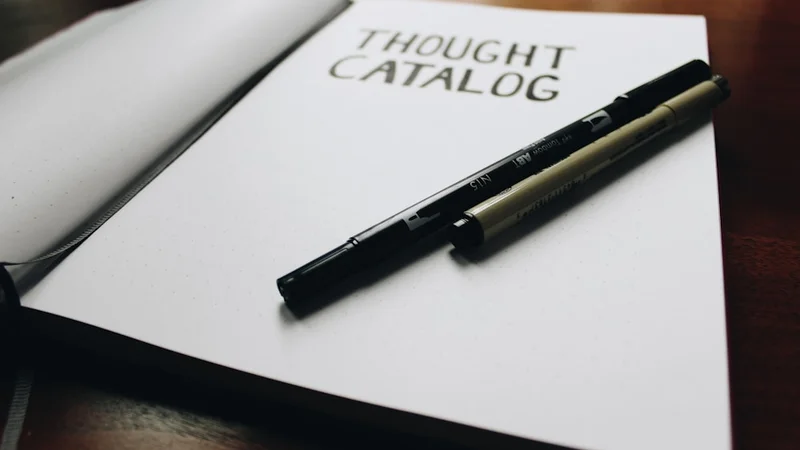 person writing in a journal at a clean wooden desk, warm morning light, focused and calm
