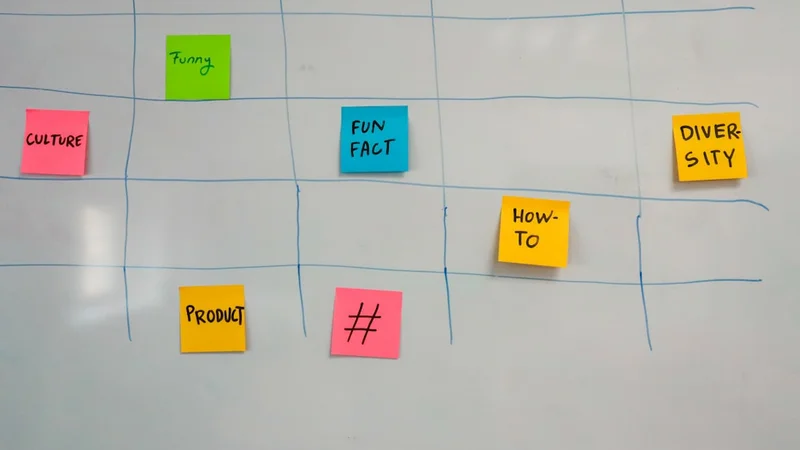 Open notebook with a simple two-column task log showing estimated vs actual time, pen resting on the page